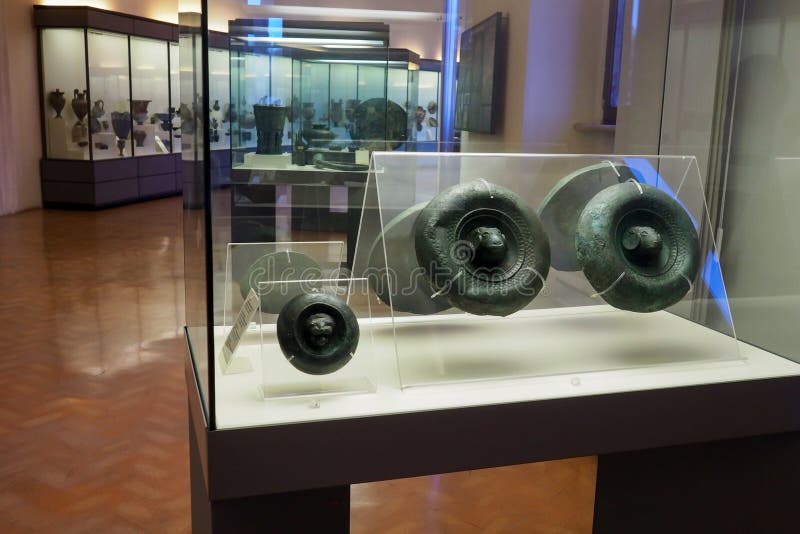 Bronze objects originating from the Castellani collection in the first floor of the National Etruscan Museum of Villa Giulia  in Rome, Italy. The collection of the important family of Roman goldsmiths dates from the 19th century and spaces from Etruscan ceramic, bronze, jewelry. Created in 1899, the Etruscan Museum of Villa Giulia houses works from pre-Roman Italian antiquity, especially from the Etruscan world. Among the museum’s most valuable objects are a sarcophagus from the year 520 BC, as well as several terracotta figures such as the Apollo of Veii and the image of Hercules and Apollo vying for the deer, both from 510 BC. The museum also presents a great collection of precious objects from antiquity to the 19th century. Bronze objects originating from the Castellani collection in the first floor of the National Etruscan Museum of Villa Giulia  in Rome, Italy. The collection of the important family of Roman goldsmiths dates from the 19th century and spaces from Etruscan ceramic, bronze, jewelry. Created in 1899, the Etruscan Museum of Villa Giulia houses works from pre-Roman Italian antiquity, especially from the Etruscan world. Among the museum’s most valuable objects are a sarcophagus from the year 520 BC, as well as several terracotta figures such as the Apollo of Veii and the image of Hercules and Apollo vying for the deer, both from 510 BC. The museum also presents a great collection of precious objects from antiquity to the 19th century.