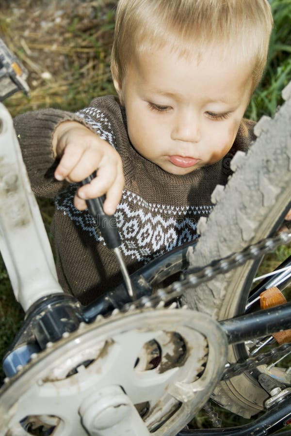 Village boy repaired a bicycle.