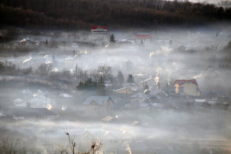 Village chimneys fog