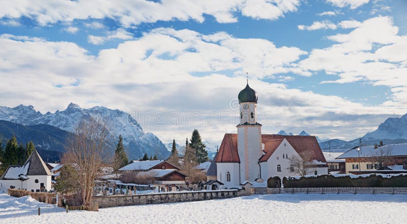 Village church wallgau in wintry landscape. Village church at spa town wallgau in wintry landscape, blue cloudy sky, upper bavaria stock photography Village church wallgau in wintry landscape. Village church at spa town wallgau in wintry landscape, blue cloudy sky, upper bavaria stock photography