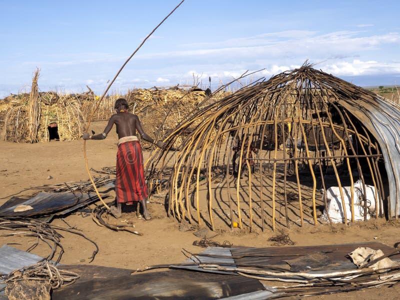 , In the village of Dassanech you can freely take pictures after the fee has been charged. OMO RIVER, TRIBE DASSANECH, MAY 11, 2019, In the village of Dassanech royalty free stock photo , In the village of Dassanech you can freely take pictures after the fee has been charged. OMO RIVER, TRIBE DASSANECH, MAY 11, 2019, In the village of Dassanech royalty free stock photo