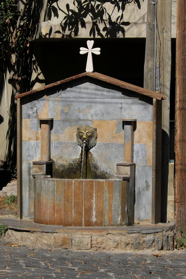 An old lion fountain in a Lebanese Village. An old lion fountain in a Lebanese Village