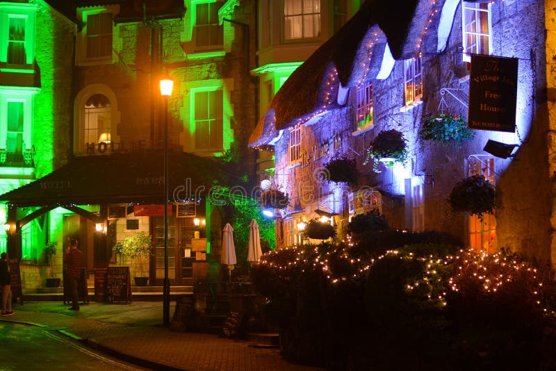 The Village Inn is a traditional English pub situated in the Old Village at Shanklin on the Isle of Wight. Here it can be seen decorated with lights for the Christmas holiday season with Holliers Hotel in the background. The Village Inn is a traditional English pub situated in the Old Village at Shanklin on the Isle of Wight. Here it can be seen decorated with lights for the Christmas holiday season with Holliers Hotel in the background.