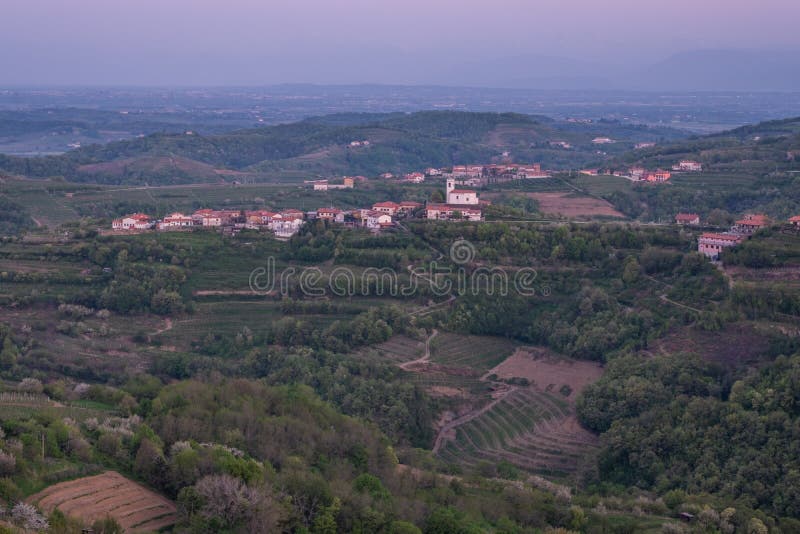 Village Vedrijan between vineyards in wine region Brda in Slovenia. Small village Vedrijan on early morning between the vineyards in the wine region Brda in royalty free stock photography Village Vedrijan between vineyards in wine region Brda in Slovenia. Small village Vedrijan on early morning between the vineyards in the wine region Brda in royalty free stock photography