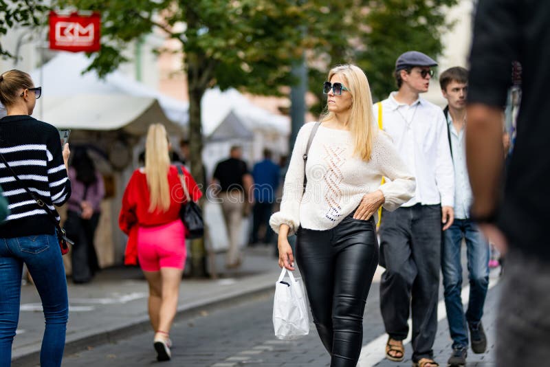 VILNIUS, LITHUANIA - SEPTEMBER 3, 2023: People attending annual Nations Fair, where masters from the national communities of Lithuania present their arts, crafts, national customs and traditions. VILNIUS, LITHUANIA - SEPTEMBER 3, 2023: People attending annual Nations Fair, where masters from the national communities of Lithuania present their arts, crafts, national customs and traditions