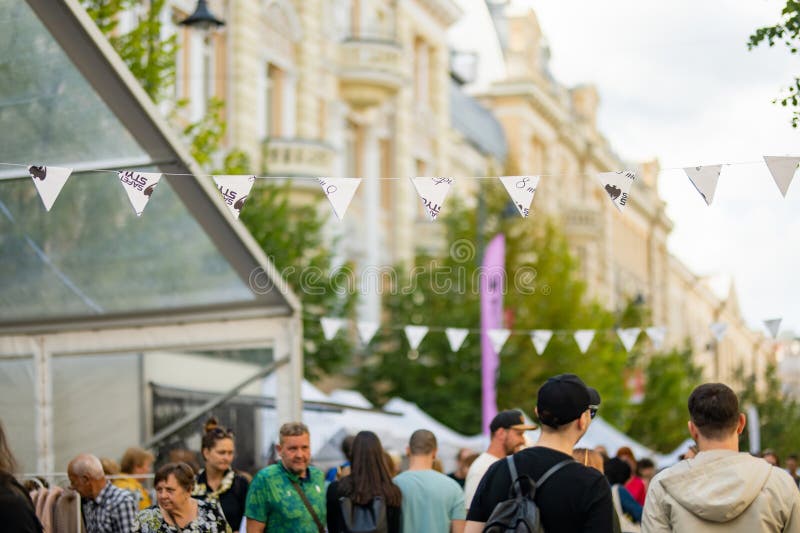 VILNIUS, LITHUANIA - SEPTEMBER 3, 2023: People attending annual Nations Fair, where masters from the national communities of Lithuania present their arts, crafts, national customs and traditions. VILNIUS, LITHUANIA - SEPTEMBER 3, 2023: People attending annual Nations Fair, where masters from the national communities of Lithuania present their arts, crafts, national customs and traditions