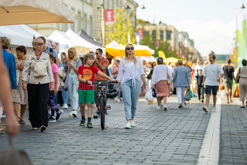 VILNIUS, LITHUANIA - SEPTEMBER 3, 2023: People attending annual Nations Fair, where masters from the national communities of Lithuania present their arts, crafts, national customs and traditions. VILNIUS, LITHUANIA - SEPTEMBER 3, 2023: People attending annual Nations Fair, where masters from the national communities of Lithuania present their arts, crafts, national customs and traditions