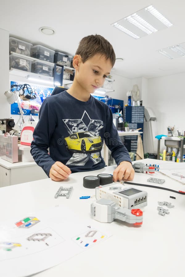 Vilnius, Lithuania - November 16, 2018: Kid making Lego robot mindstorms. Robotic, learning, technology, stem education