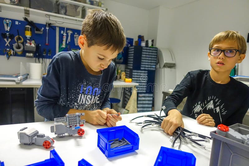 Vilnius, Lithuania - November 23, 2018: Kids making Lego robot mindstorms. Robotic, learning, technology, stem education