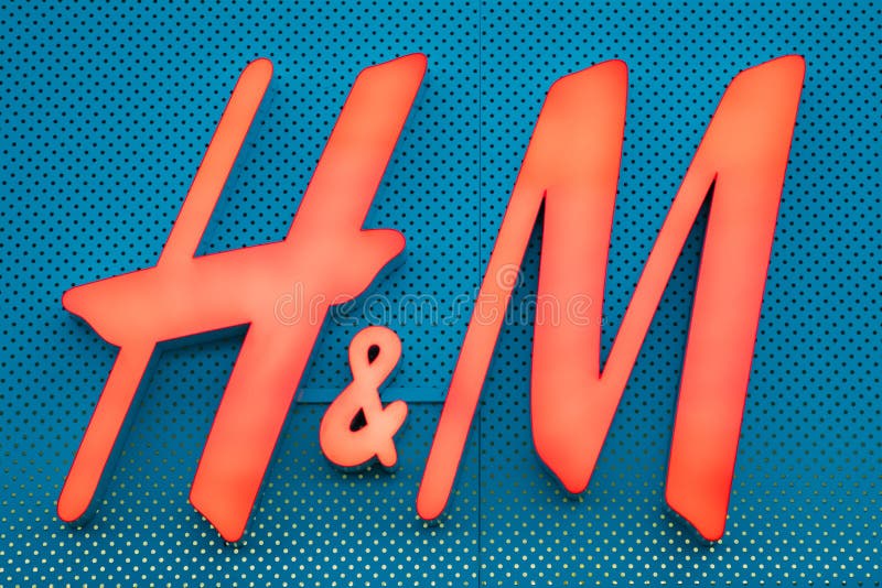 Illuminated Red Logotype H M of Hennes Mauritz Brand at Blue Wall of Store  in Shopping Center. Editorial Stock Photo - Image of shop, luminous:  239529403