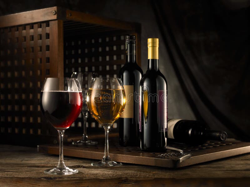 Red and white wine composition in mood lighting. Red and white wine composition in mood lighting