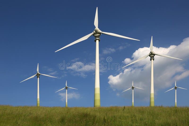 Vindturbiner på en änggräsplanenergi arkivfoto
