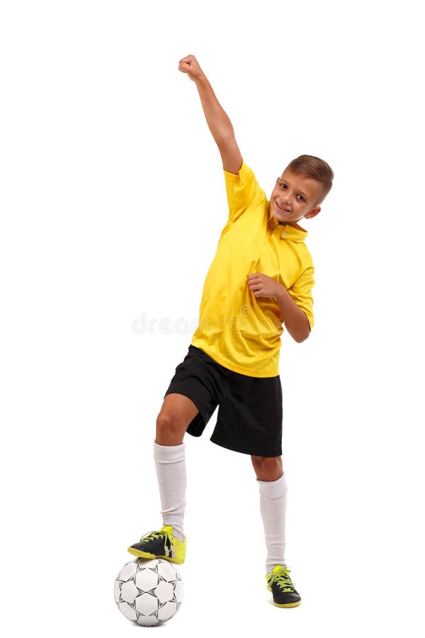 Vinnaren tog det första stället En lycklig pojke med hans ben på en fotbollboll som isoleras på en vit bakgrund Hellångt arkivfoto Vinnaren tog det första stället En lycklig pojke med hans ben på en fotbollboll som isoleras på en vit bakgrund Hellångt arkivfoto