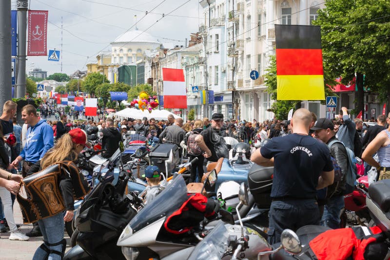A rally of bikers for the celebration of Europe Day and people looking at what is happening royalty free stock photo A rally of bikers for the celebration of Europe Day and people looking at what is happening royalty free stock photo