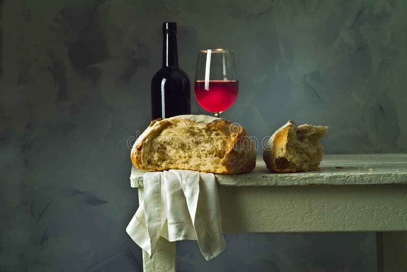 Red wine glass, bottle and loaf of sour dough bread. Red wine glass, bottle and loaf of sour dough bread