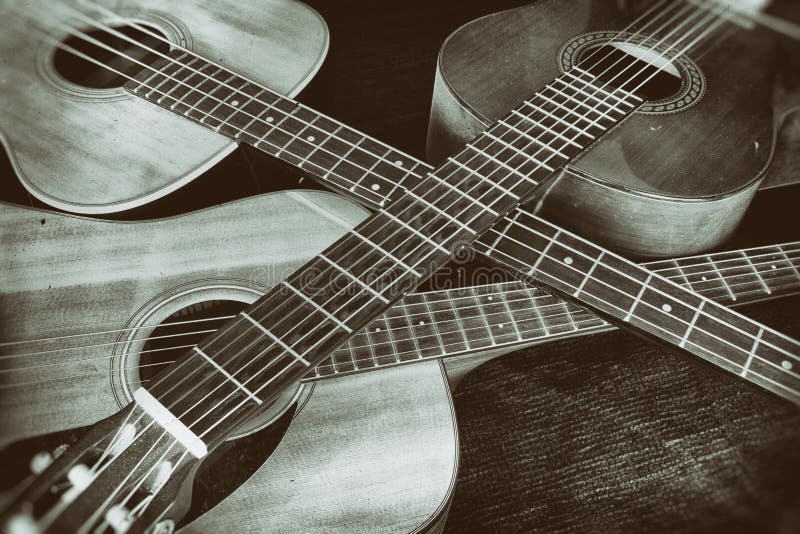 Vintage Acoustic Guitars Crossed stock photography