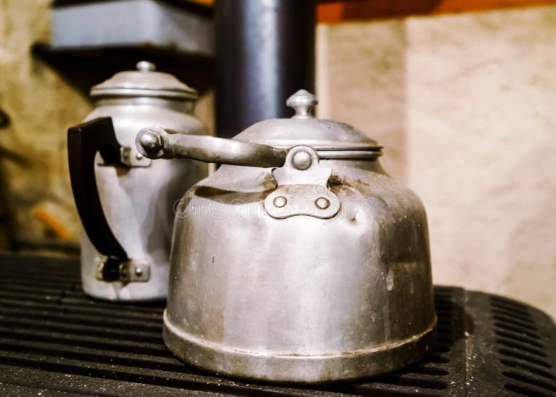 Vintage aluminium teapots in old house