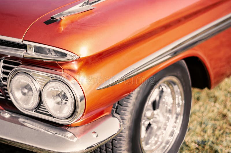 Vintage american car - close up of headlight and radiator. detail of nice line shiny old mobile