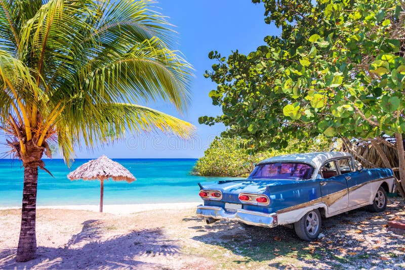 Vintage american oldtimer car on a beach in Cuba. Vintage american oldtimer car parked on a beach in Cuba stock photo Vintage american oldtimer car on a beach in Cuba. Vintage american oldtimer car parked on a beach in Cuba stock photo