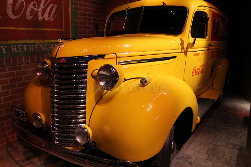 Vintage American yellow Coca-Cola delivery truck from Argentina on display. World of Coca-Cola Museum. Atlanta, Georgia. 1939 Chevrolet truck. Vintage American yellow Coca-Cola delivery truck from Argentina on display. World of Coca-Cola Museum. Atlanta, Georgia. 1939 Chevrolet truck.