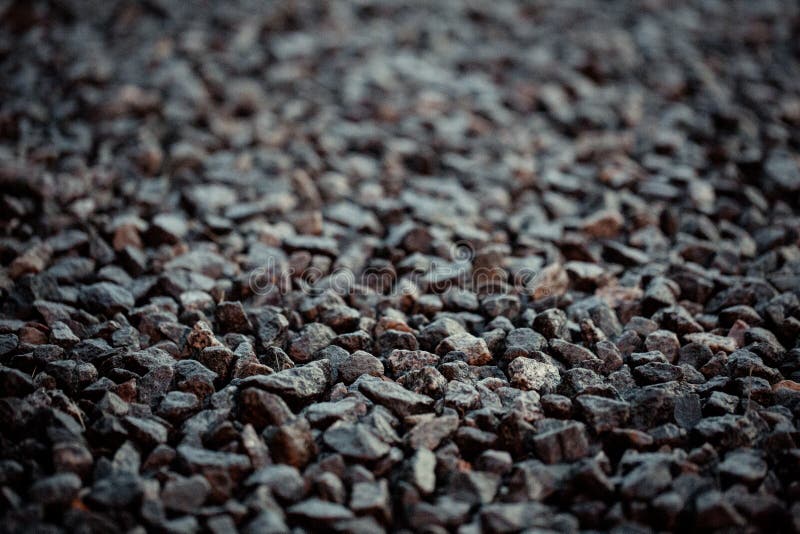 Vintage background of gravel. film grain. Texture of a wet road. One of a million. A special and outstanding object