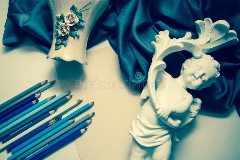 Vintage background with pencils and sculpture stock photography Vintage background with pencils and sculpture stock photography