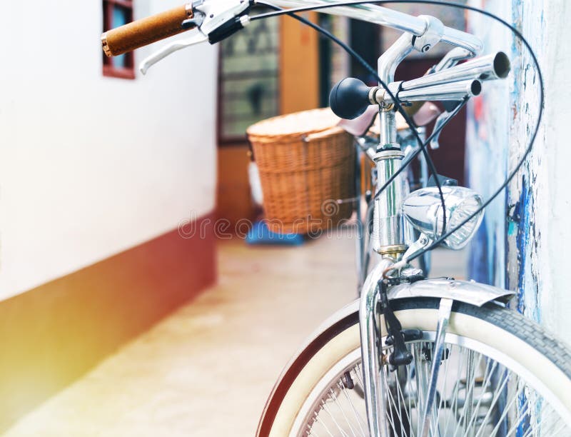 Vintage bicycle parking lean on the house wall. Summer vintage concept stock image Vintage bicycle parking lean on the house wall. Summer vintage concept stock image