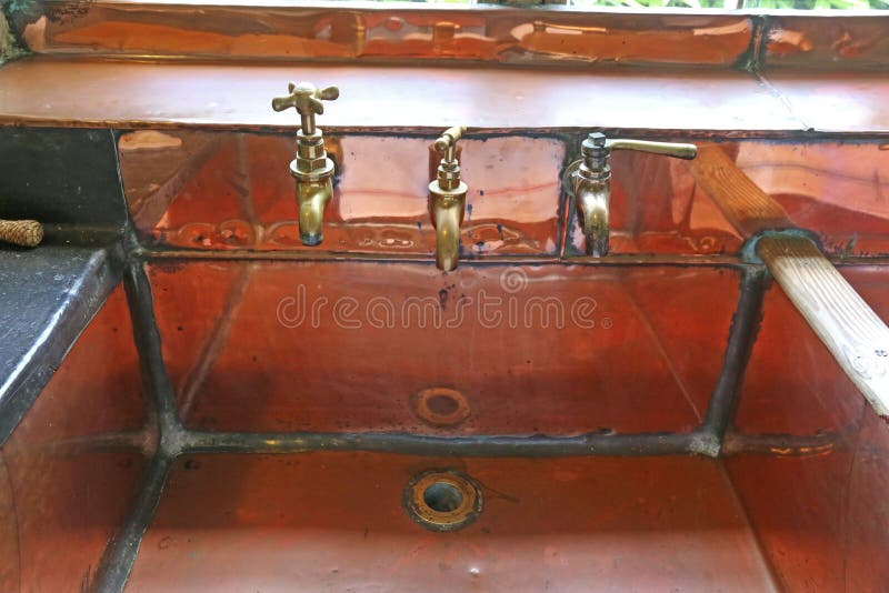 Brass taps and sink stock photo. Image of drain, water 233475860