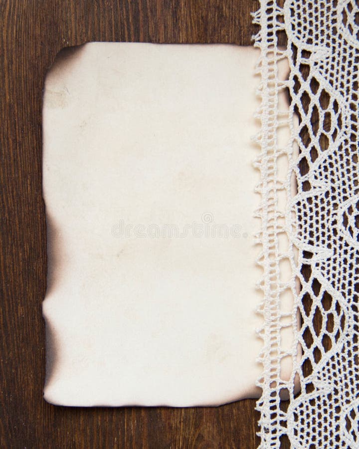 Vintage burned paper card and crochet lace stock photography Vintage burned paper card and crochet lace stock photography