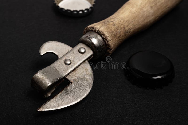 https://thumbs.dreamstime.com/b/vintage-can-opener-beer-corks-black-surface-high-quality-photo-vintage-can-opener-beer-corks-black-surface-215267242.jpg