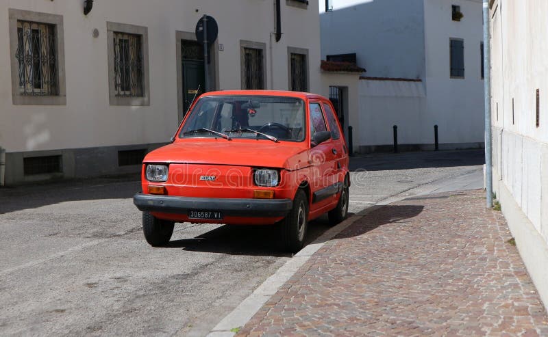 Vintage car Fiat 126 parked in a street. It is a city car of the Seventies stock image Vintage car Fiat 126 parked in a street. It is a city car of the Seventies stock image
