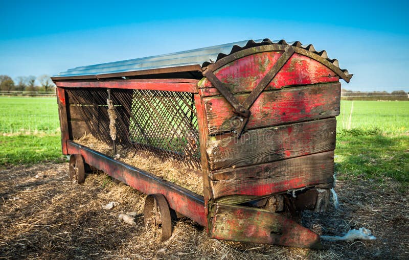 Vintage Cattle Feeder stock photo. Image of wheels, wooden 37011700