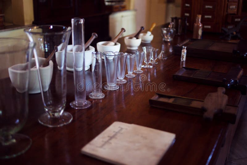 Vintage ceramic mortar and beakers. Chemical laboratory, pharmacy