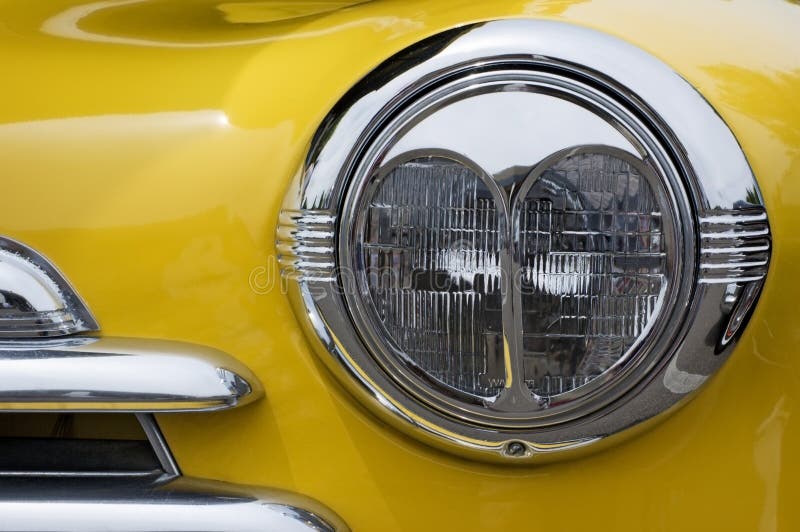 Vintage Chevy Automobile Headlight stock photography