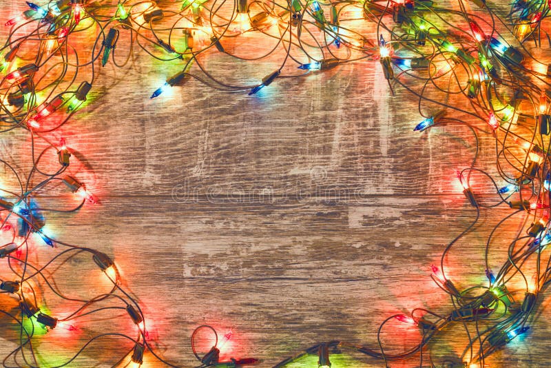 Vintage christmas background. Old Christmas garland on a wooden background. New Year background. Christmas decorations. Xmax background. Toned image. Vintage christmas background. Old Christmas garland on a wooden background. New Year background. Christmas decorations. Xmax background. Toned image.