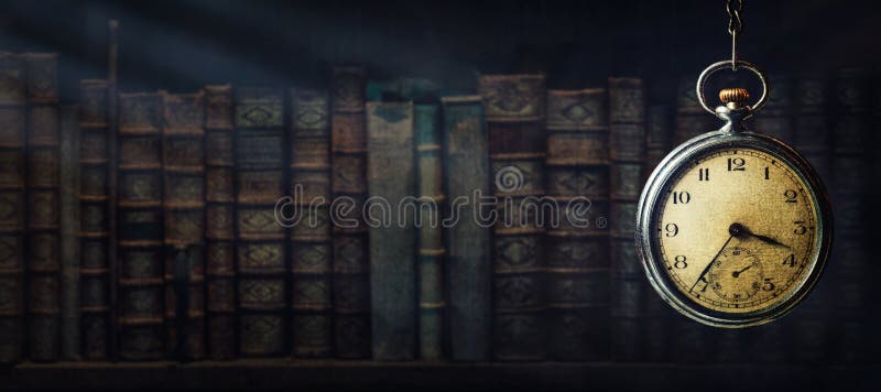 Vintage clock hanging on a chain on the background of old books and sun rays. Old watch as a symbol of passing time. Concept on