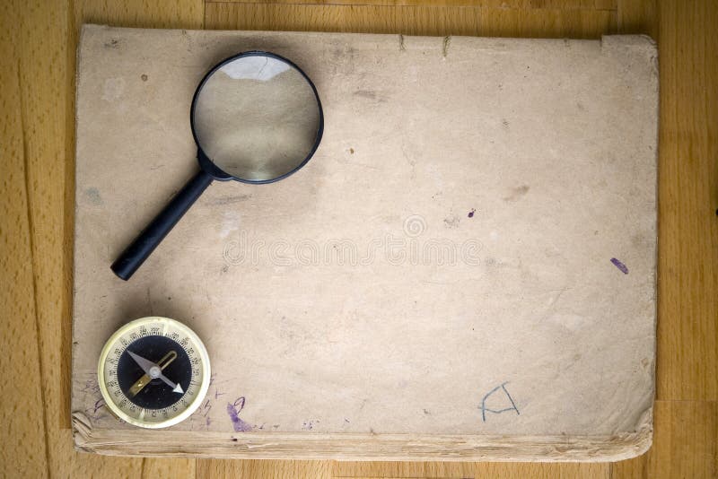 Vintage compass and magnifying glass