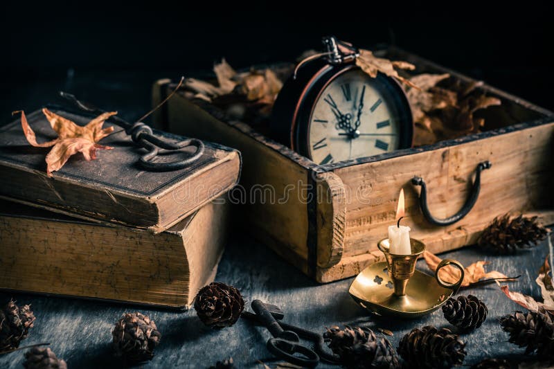 Vintage still life with antique books, clock and candle. Halloween and occult concept. Vintage still life with antique books, clock and candle. Halloween and occult concept.