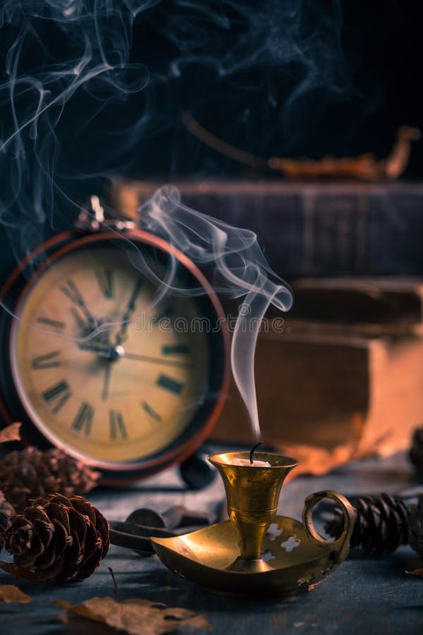 Vintage still life with antique books, clock and candle. Halloween and occult concept. Vintage still life with antique books, clock and candle. Halloween and occult concept.