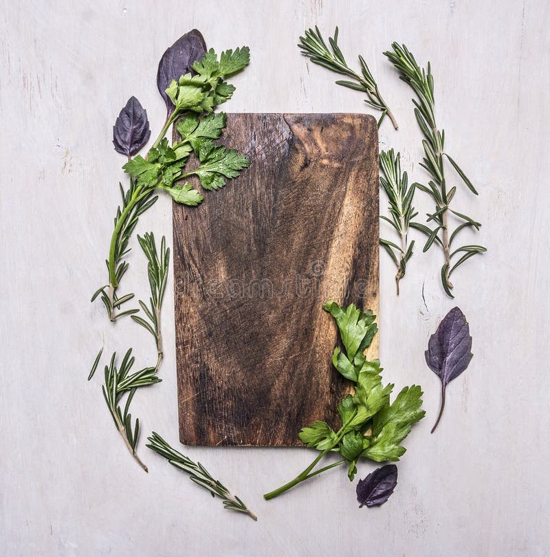 Vintage cutting board with herbs on wooden rustic background top view close up place for text, frame. Vintage rustic recipe book background stock images, royalty-free photos and pictures