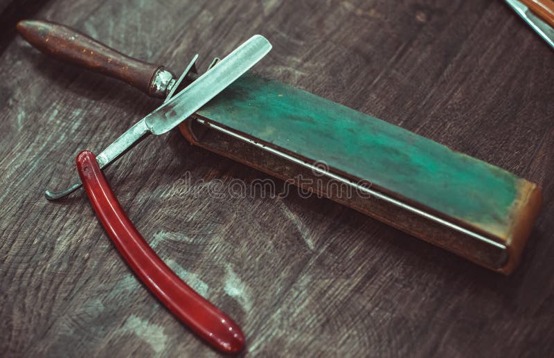 Vintage dangerous razor with leather sharpener
