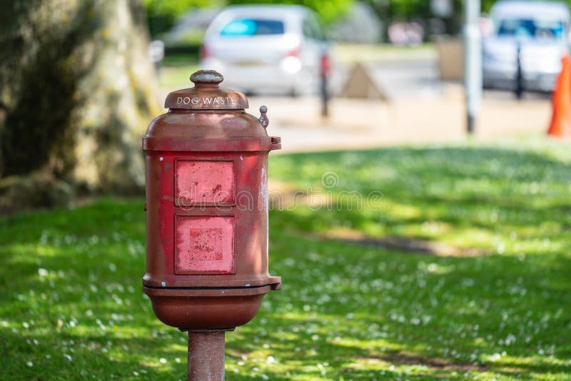 Vintage dog waste bin in the park for responsible owners to dispose of their dog`s toilet royalty free stock images Vintage dog waste bin in the park for responsible owners to dispose of their dog`s toilet royalty free stock images