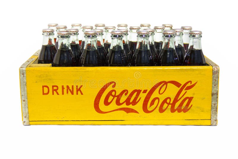 A product shot of a vintage Drink Coca-Cola crate and full bottles, nostalg...
