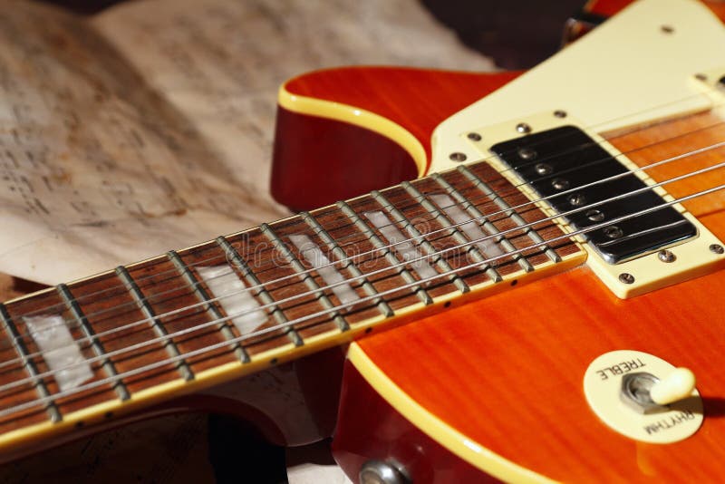 Vintage Electric Jazz Guitar and Old Notes Closeup Stock Photo Image