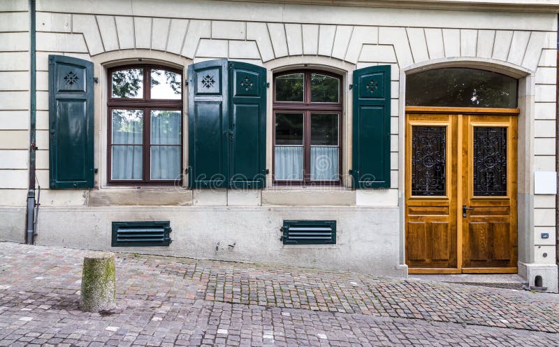 Vintage European style building facade with door and windows in Zurich, Switzerland stock images Vintage European style building facade with door and windows in Zurich, Switzerland stock images