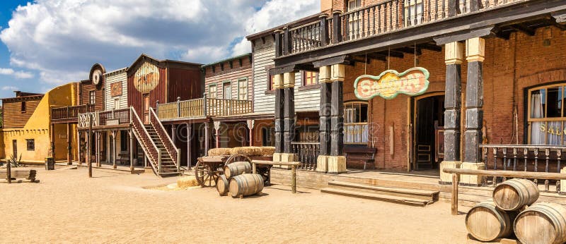 Vintage Far West town with saloon. Old wooden architecture in Wild West