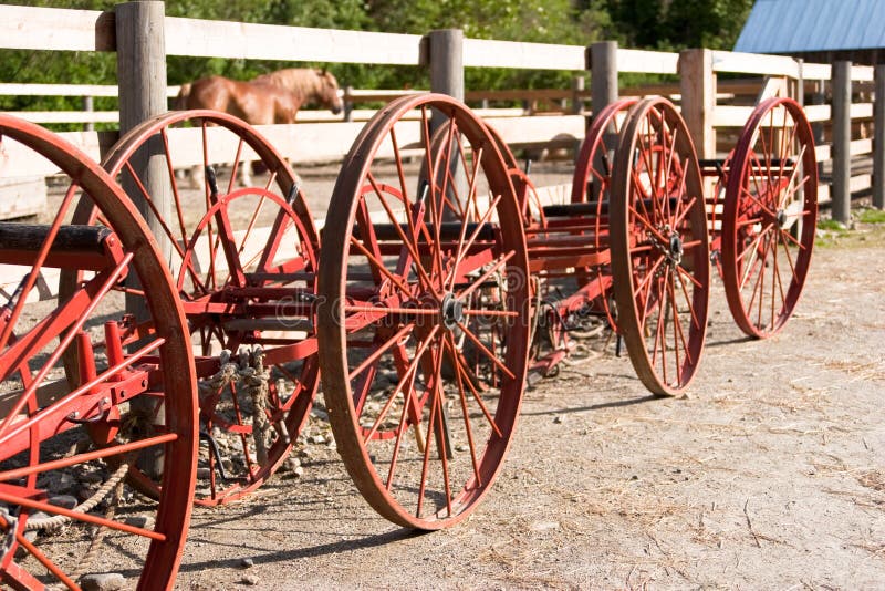 Vintage farm equipement wheels royalty free stock photos