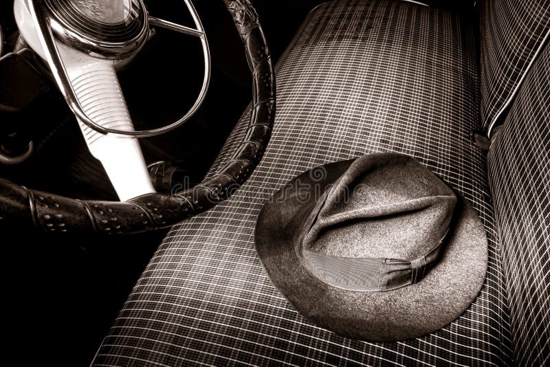 Vintage Fedora Felt Hat on Old Antique Car Seat stock photo Vintage Fedora Felt Hat on Old Antique Car Seat stock photo