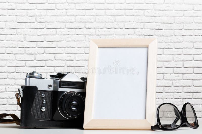 Vintage film camera and blank photo frame royalty free stock photography Vintage film camera and blank photo frame royalty free stock photography
