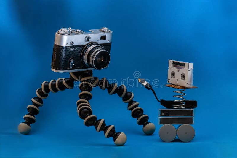Vintage Film Camera and Video Cassettes on a Blue Background. Card Reader  and Memory Card Stock Image - Image of drive, artificial: 214980913